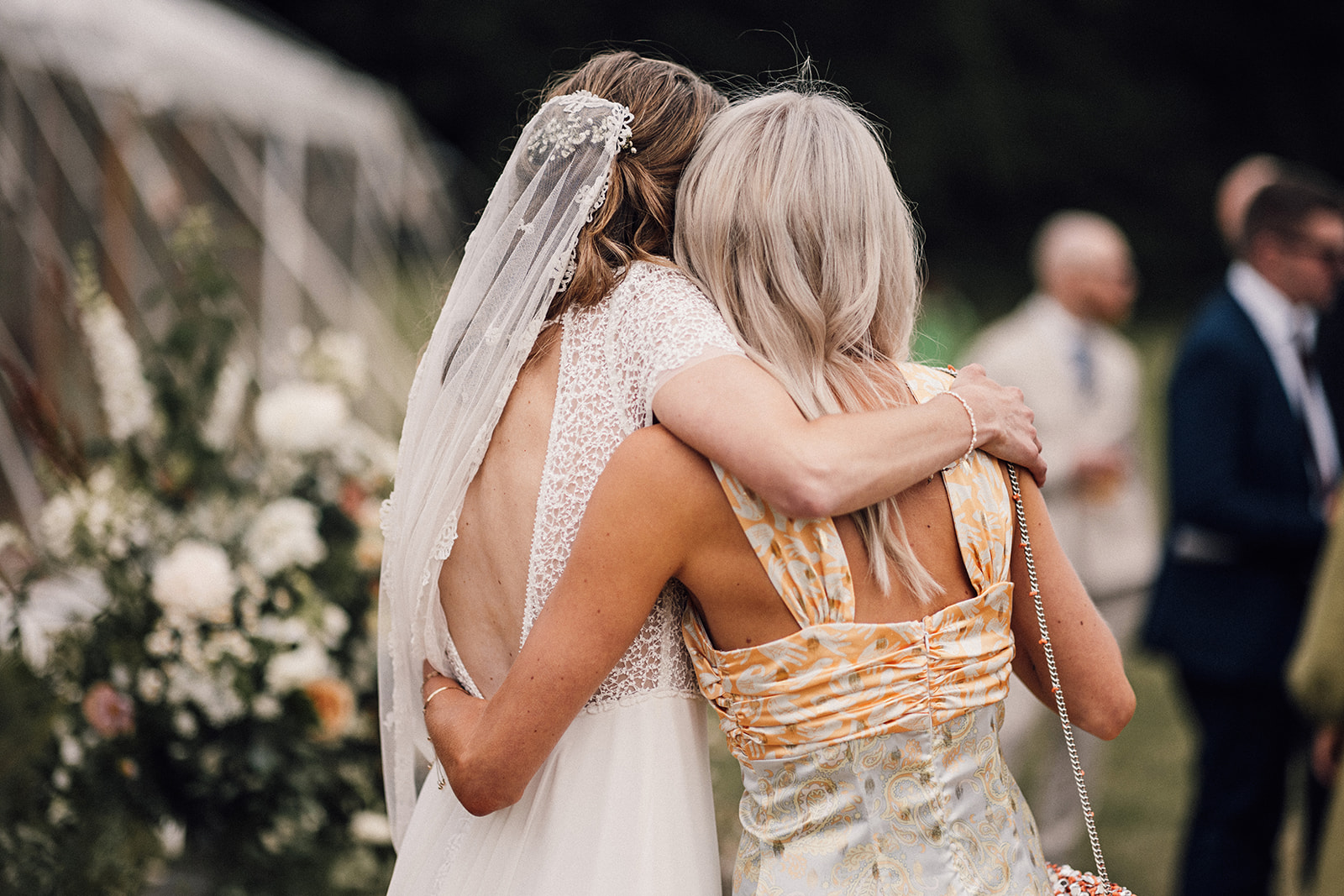 Bride embracing a guest at an Oxfordshire wedding