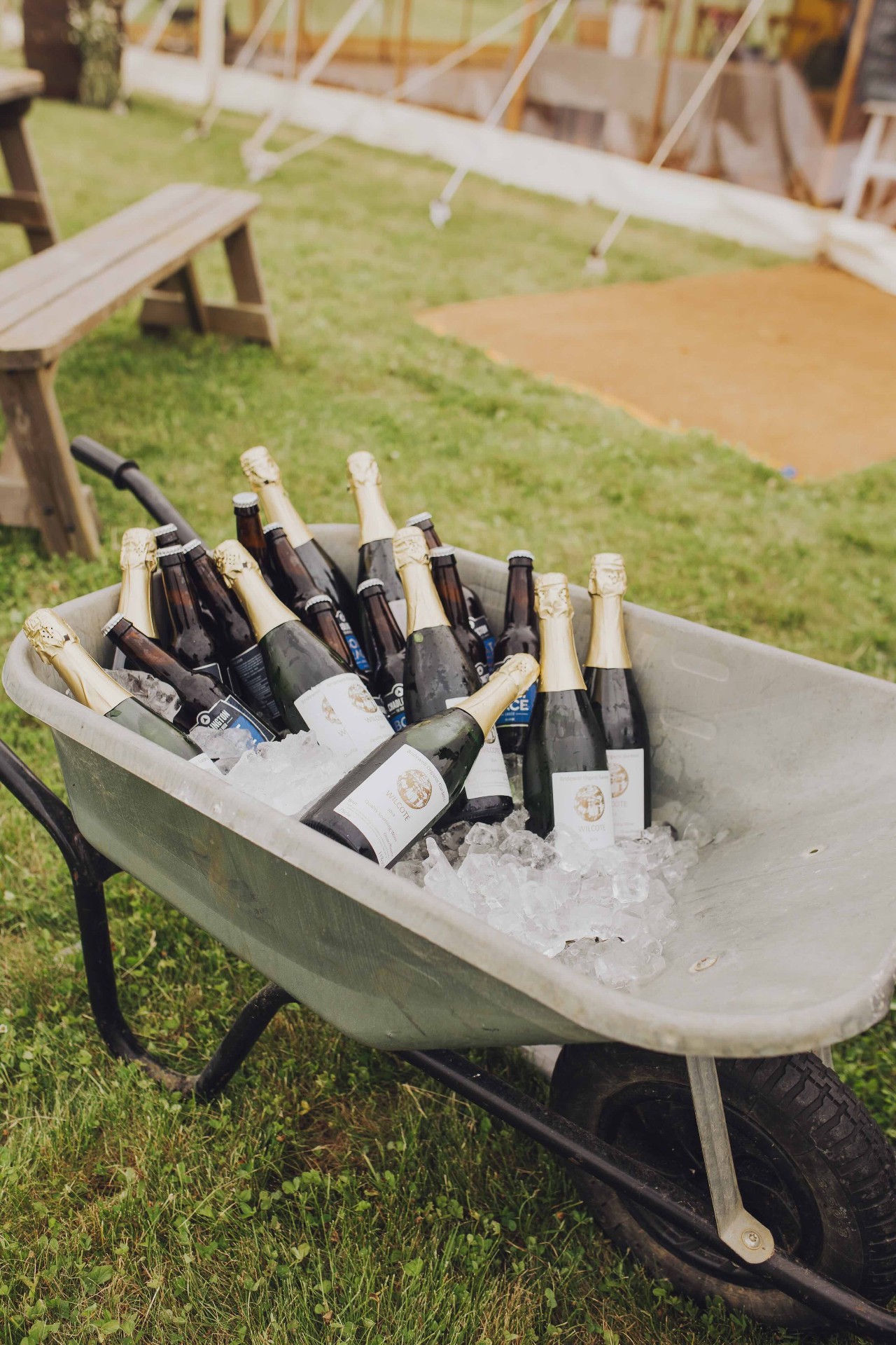 Bottles in wheelbarrow on ice